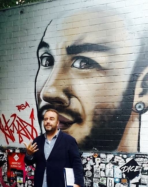 Tour guide by street art
