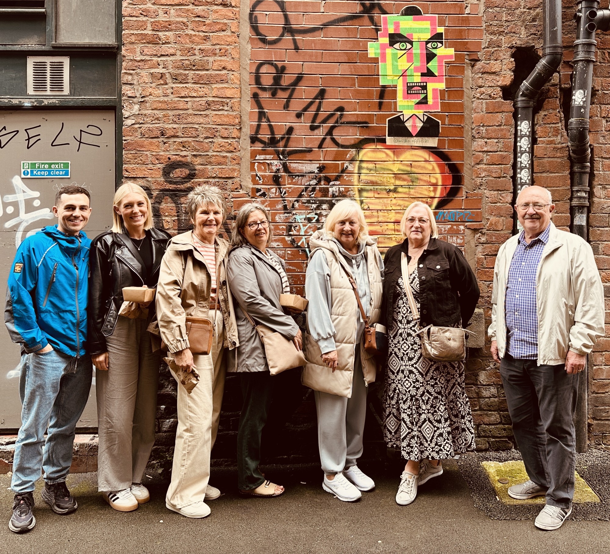 Tour group in front of street art